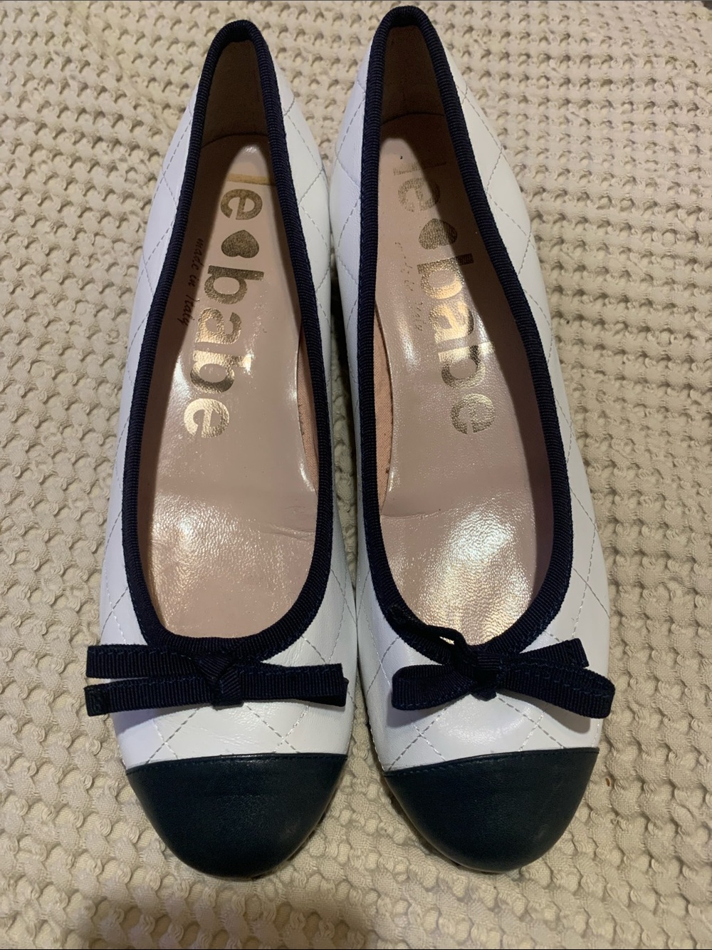 Reba White Quilted Ballet Flats with Black Trim and Bow